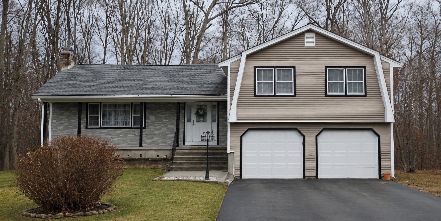 A tan home with a two-car garage